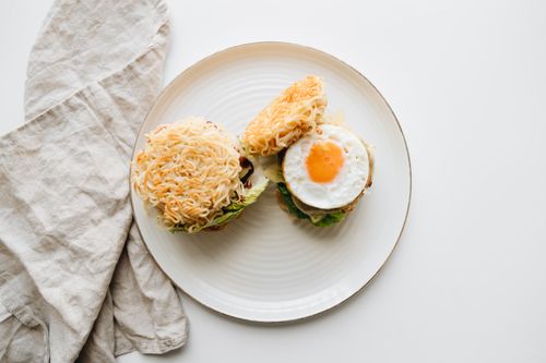Free A homemade ramen burger topped with fried egg, offering a unique twist on traditional burgers. Stock Photo