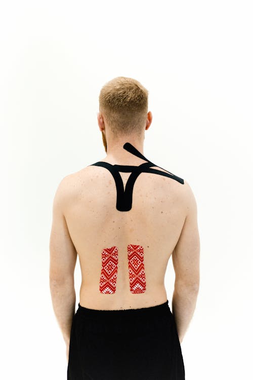 Free A Man with Medical Tapes on His Back Stock Photo