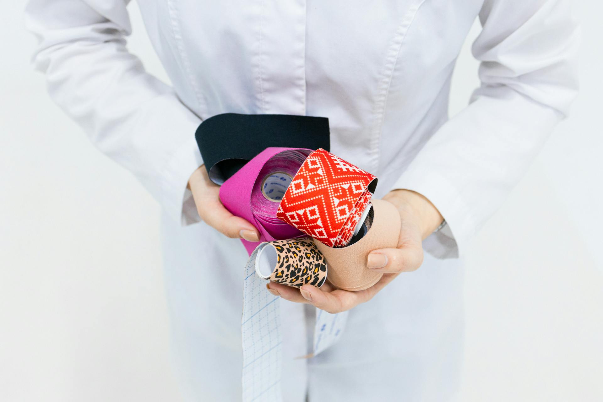 A Person Holding Elastic Therapeutic Tape