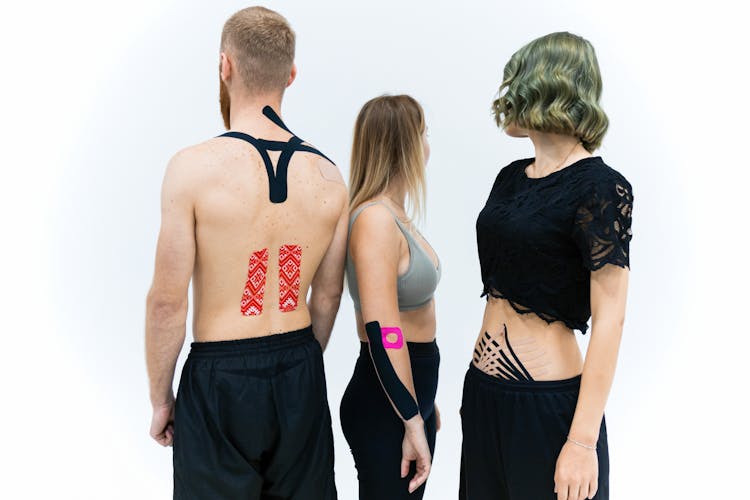 People With Elastic Therapeutic Tape 