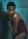 African American woman in body standing in room