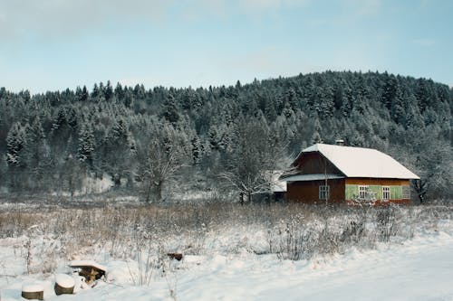 Old Wooden House in Winter Mountain Landscape