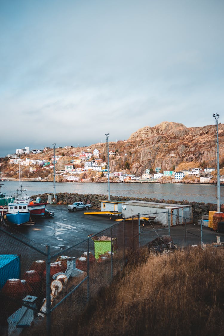 Harbor Placed Near River Against Rocky Hills