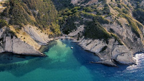 Blue Bay Meeting Rocky Cliffs