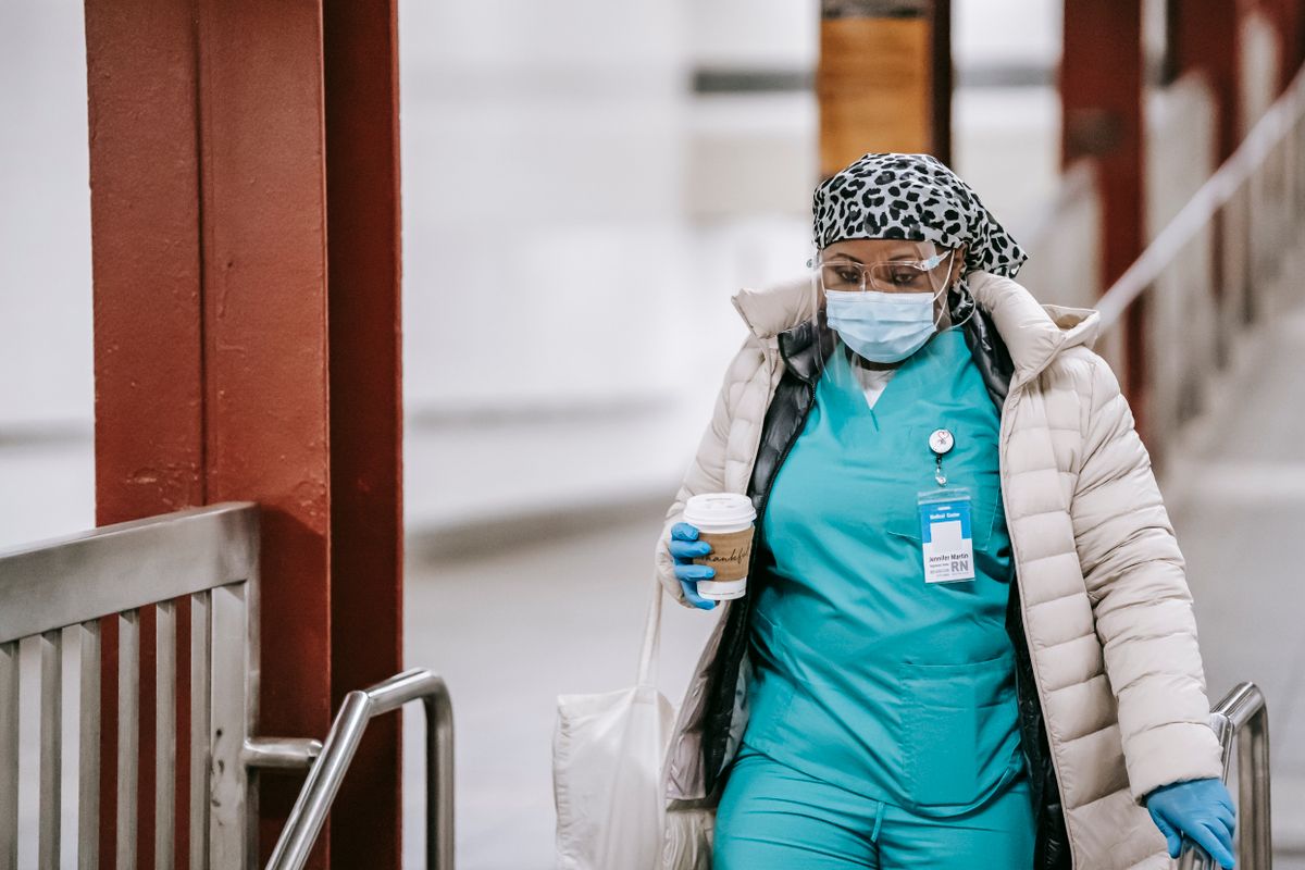 Healthcare worker in scrubs