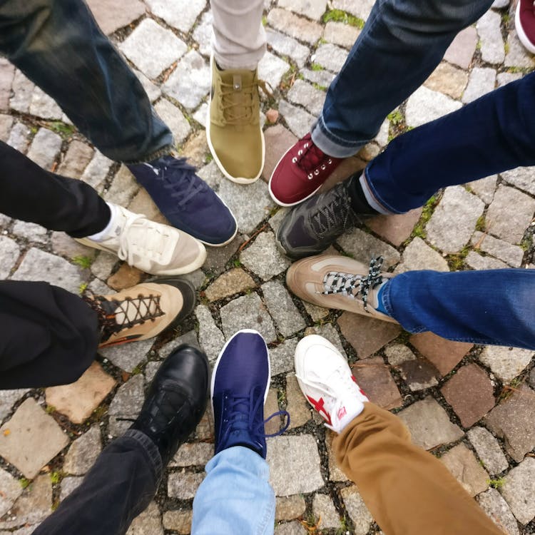 Free People Forming Round by Shoes Stock Photo