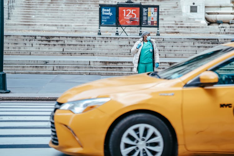 Black Physician Against Taxi Car On City Road