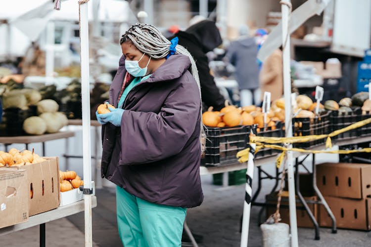 Black Lady Nurse Choosing Food In Market