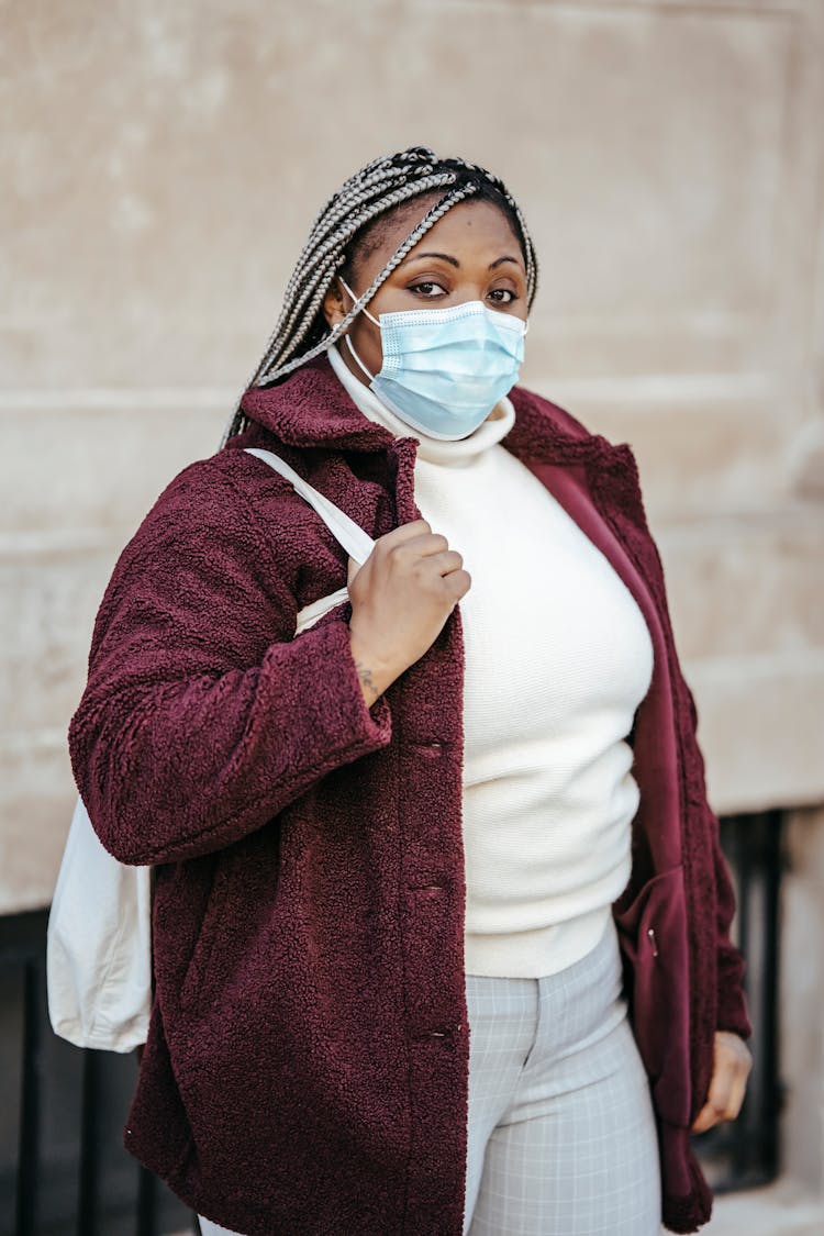 Black Lady Wearing Medical Mask In Street