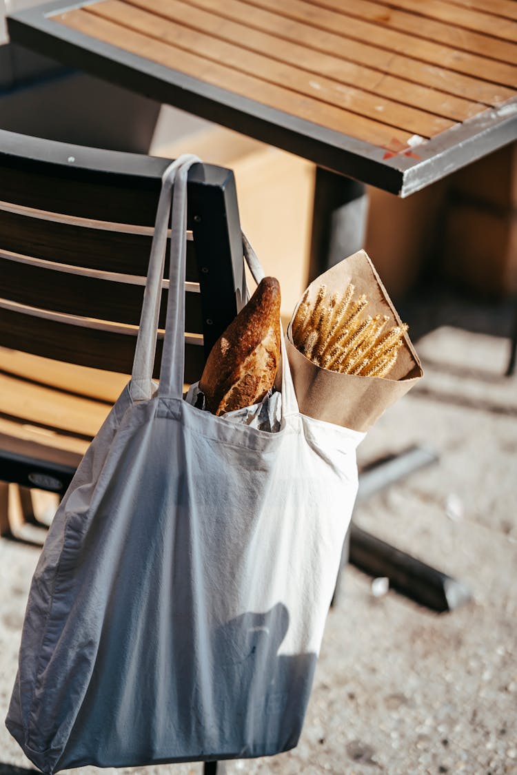 Fresh Bread Loaf With Cereal Grass Wrapped In Paper