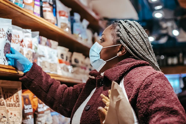 Black Woman Choosing Chia Seeds In Shopping Mall