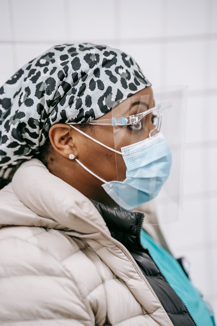 African American Nurse In Protective Uniform