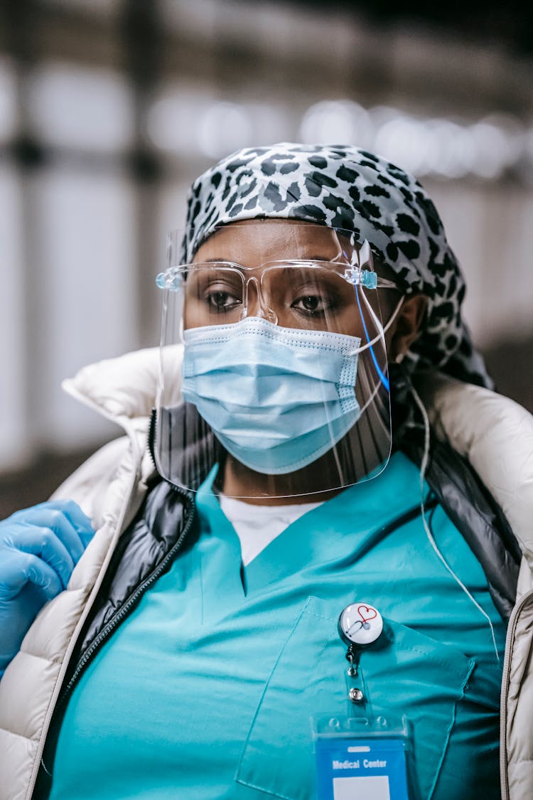 Black Woman In Medical Mask And Gloves