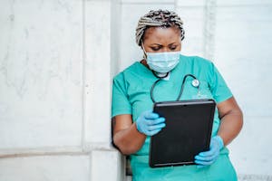 Focused woman with documents in hospital