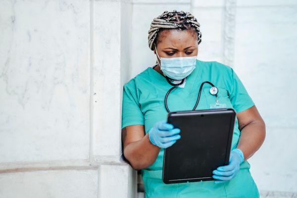 A doctor reviewing patient records