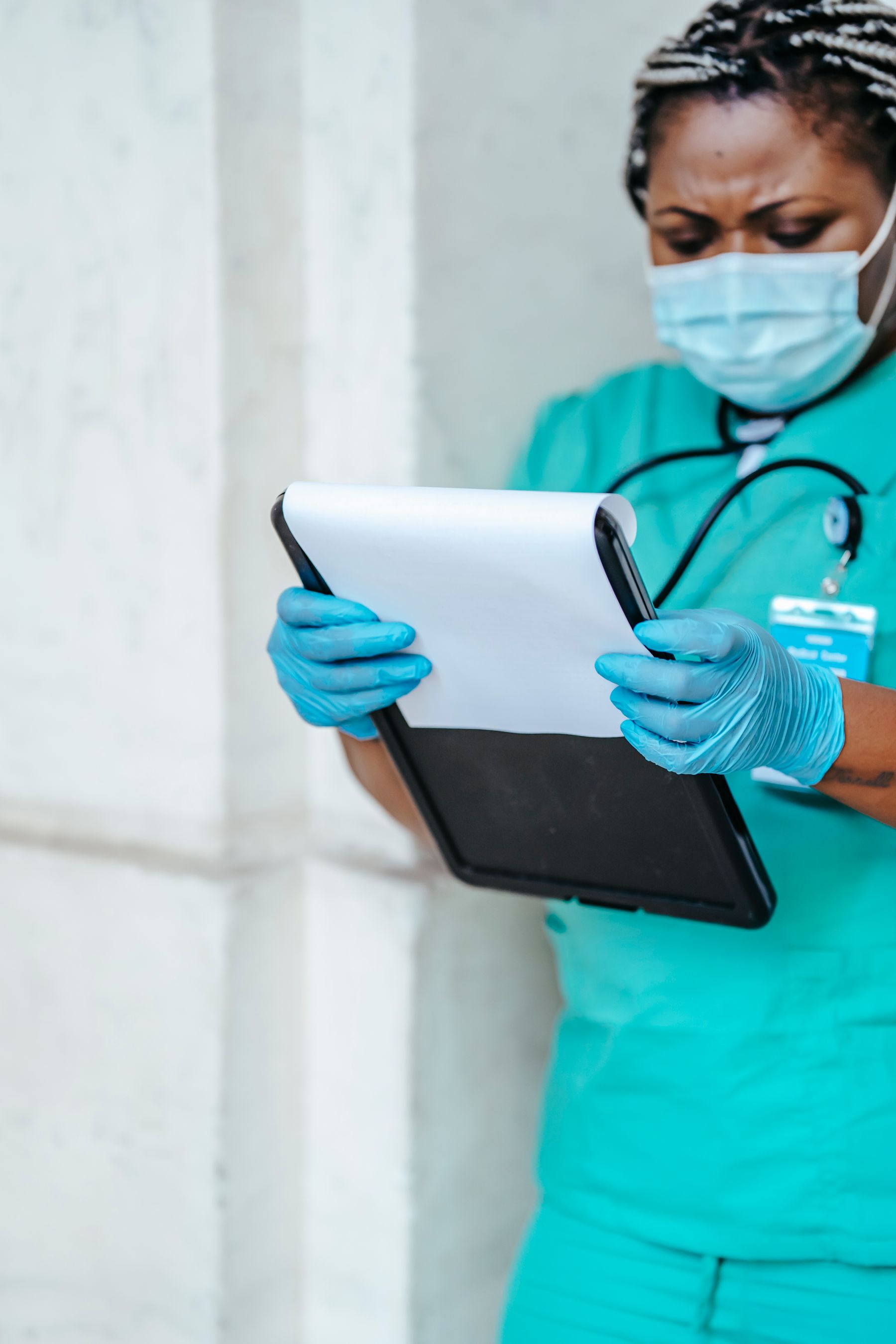 Nurse reviewing required clinical documentation before a shift