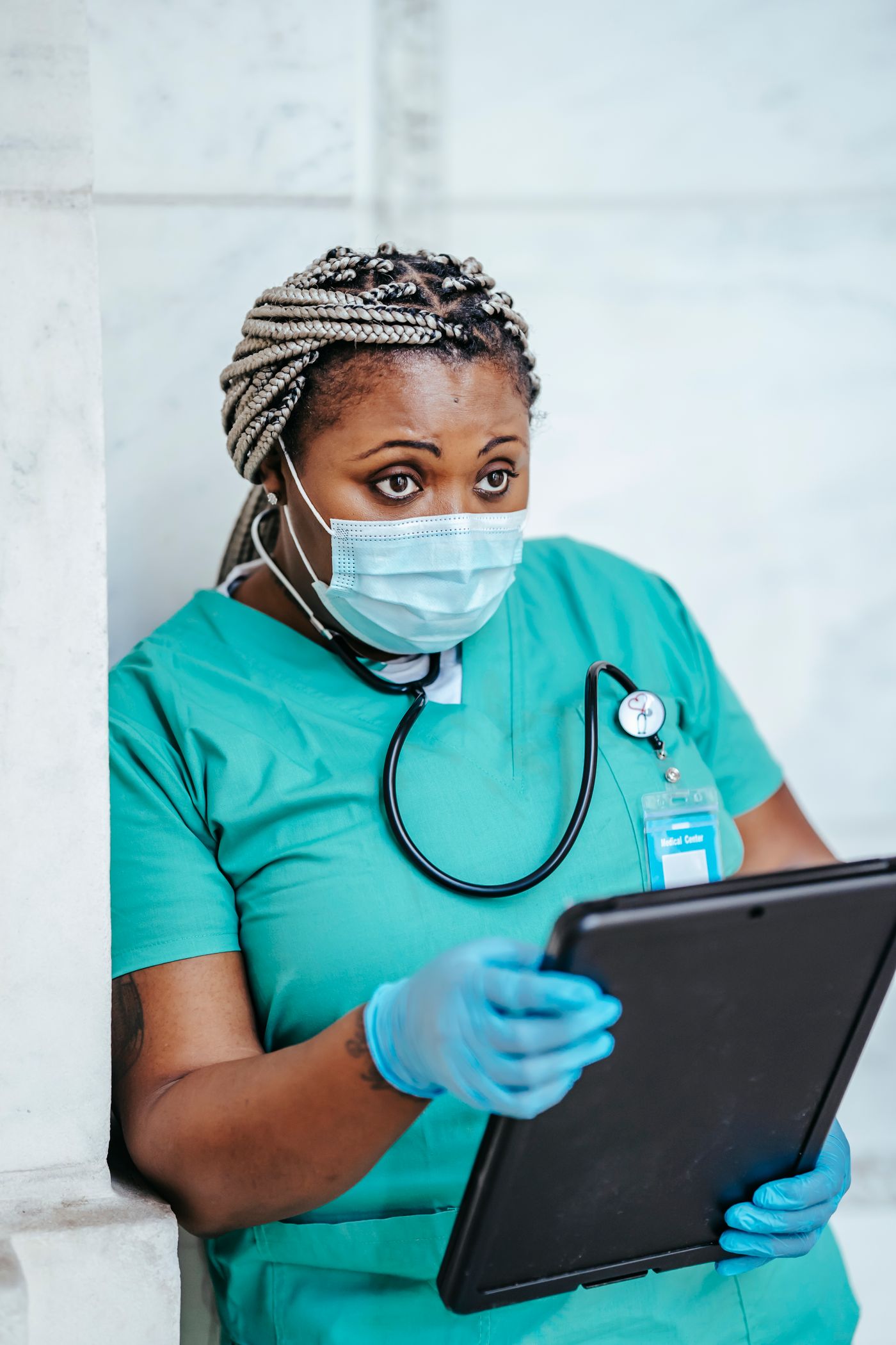 Healthcare worker reviewing documents in a hospital