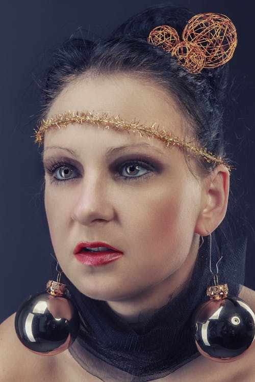 Portrait of a Beautiful Woman with Christmas Ball Earrings