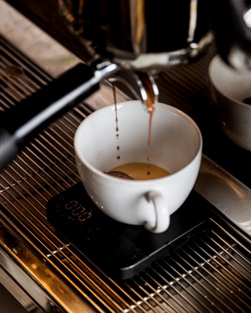 Free Coffee Dripping From the Espresso Machine Stock Photo