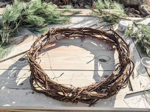 Brown Wooden Wreath on Wooden Table