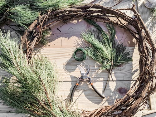 Making Wreath from Wood and Conifer Branches