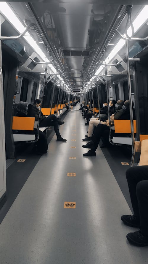 Commuters Wearing Face Mask while Sitting on the Train