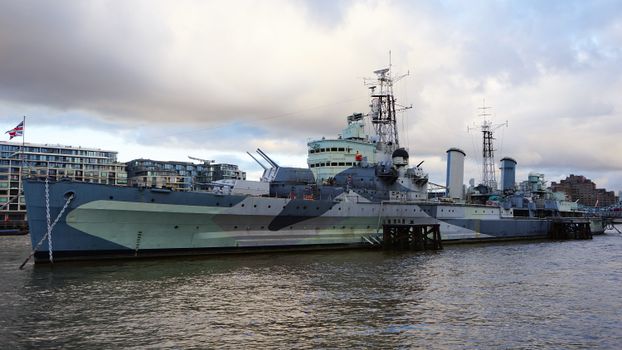 A striking view of HMS Belfast on the River Thames, showcasing naval heritage.