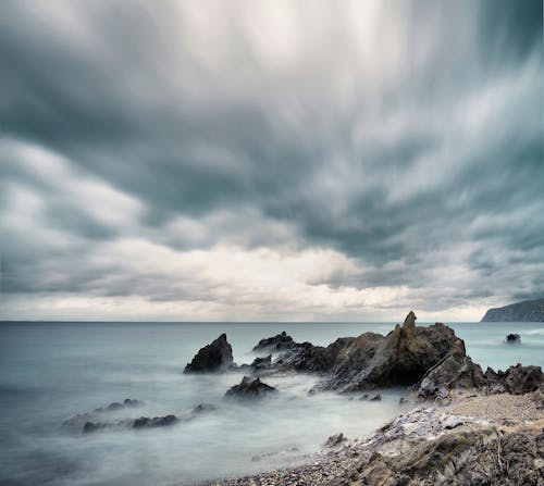 Foto profissional grátis de água, céu, costa