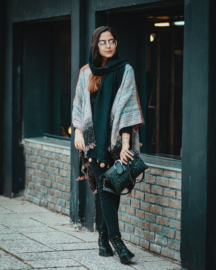 A Woman Walking On The Sidewalk