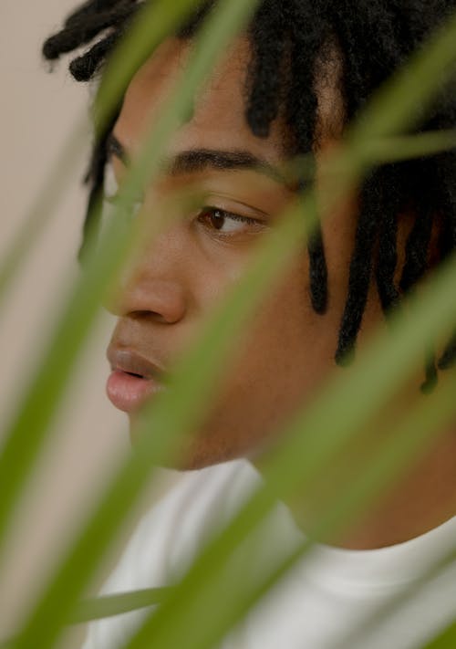 
A Close-Up Shot of a Man with Dreadlocks