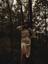 Woman in White Dress Shirt Standing in Forest