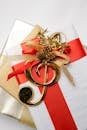 Top view of golden treble clef on present boxes with ribbons and pine cones during New Year holiday