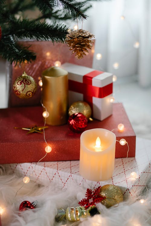 Free Gift boxes with burning candles Stock Photo