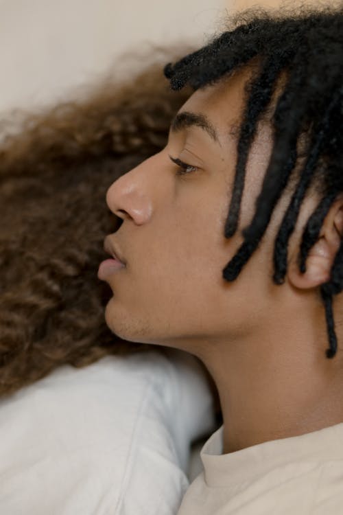 Man Wearing Crew Neck T-Shirt With Dreadlocks