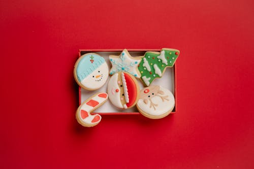 Free Box with festive Christmas biscuits topped with icing Stock Photo