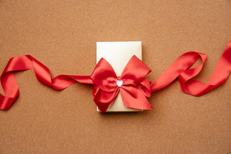 Gift Box Decorated With Red Ribbon