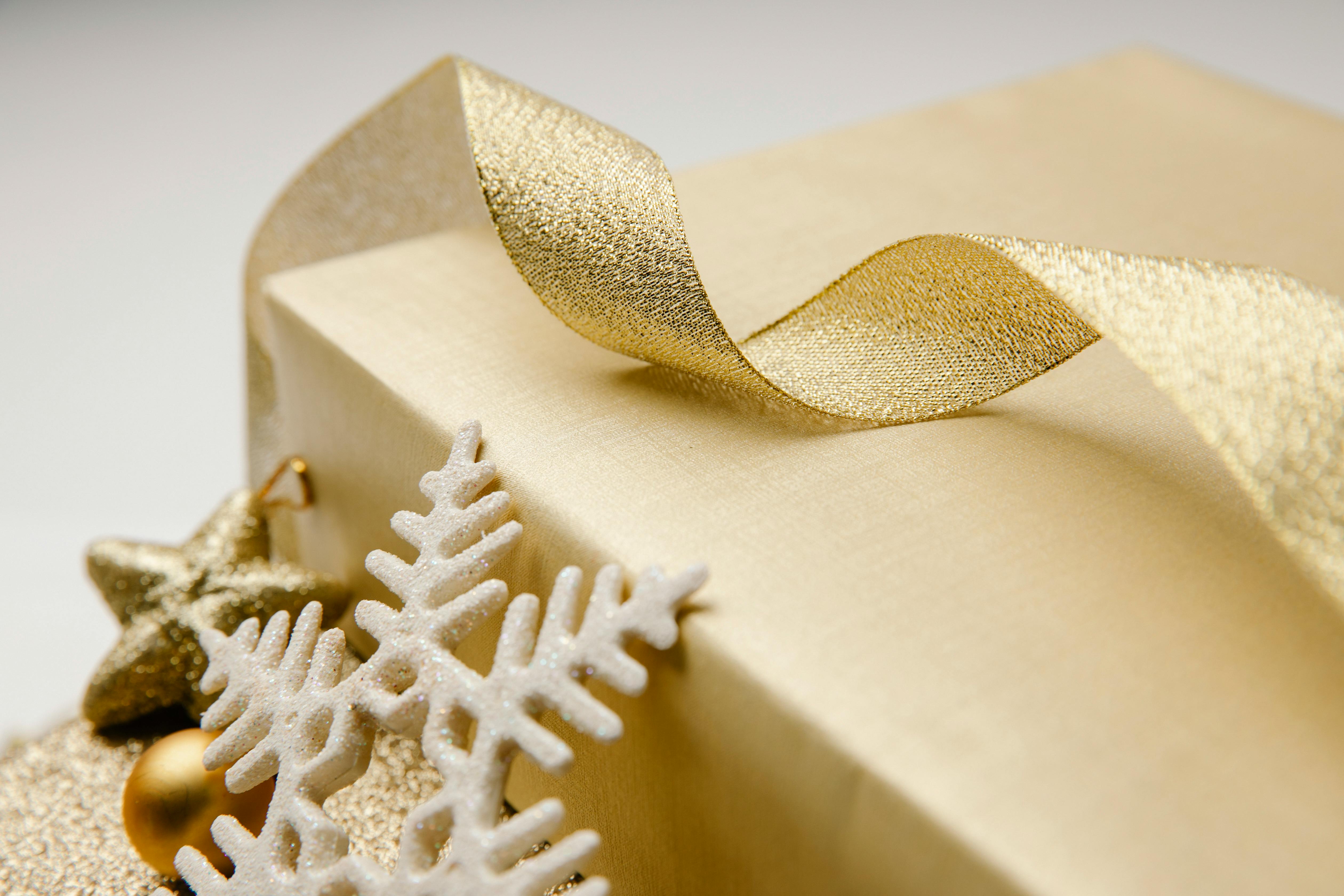 christmas composition of gift box and wavy ribbon