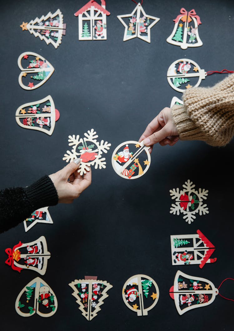 People With Colourful Paper Christmas Decorations