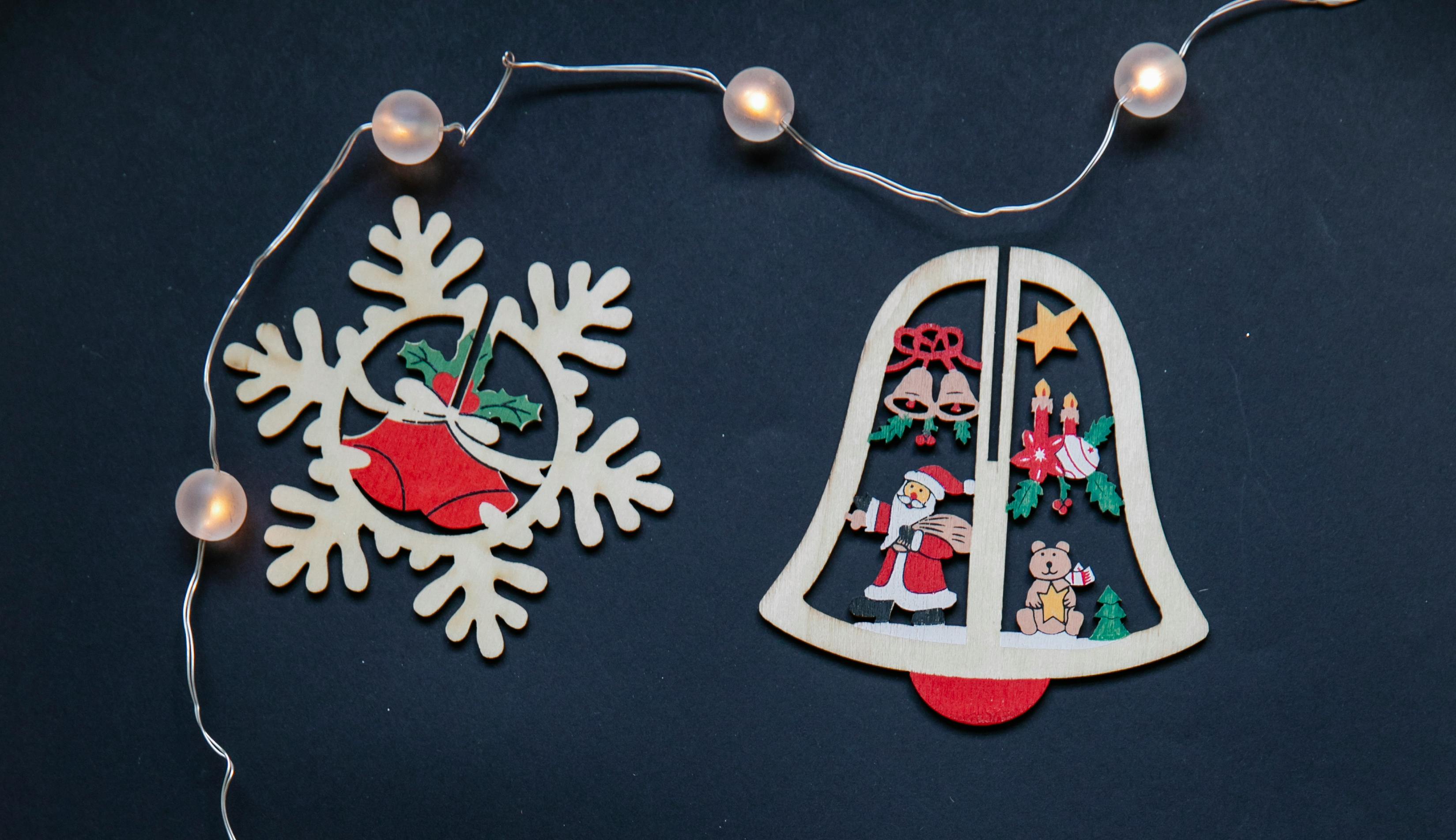 christmas decorations with garland on dark surface