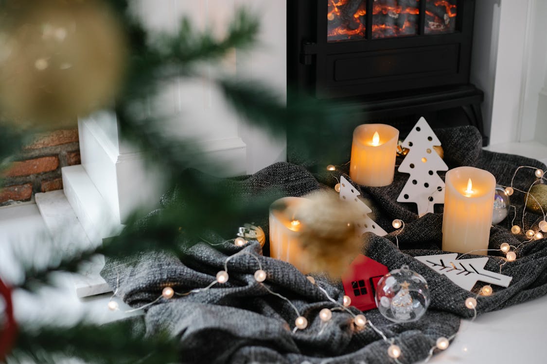 Christmas decorations near fireplace at home