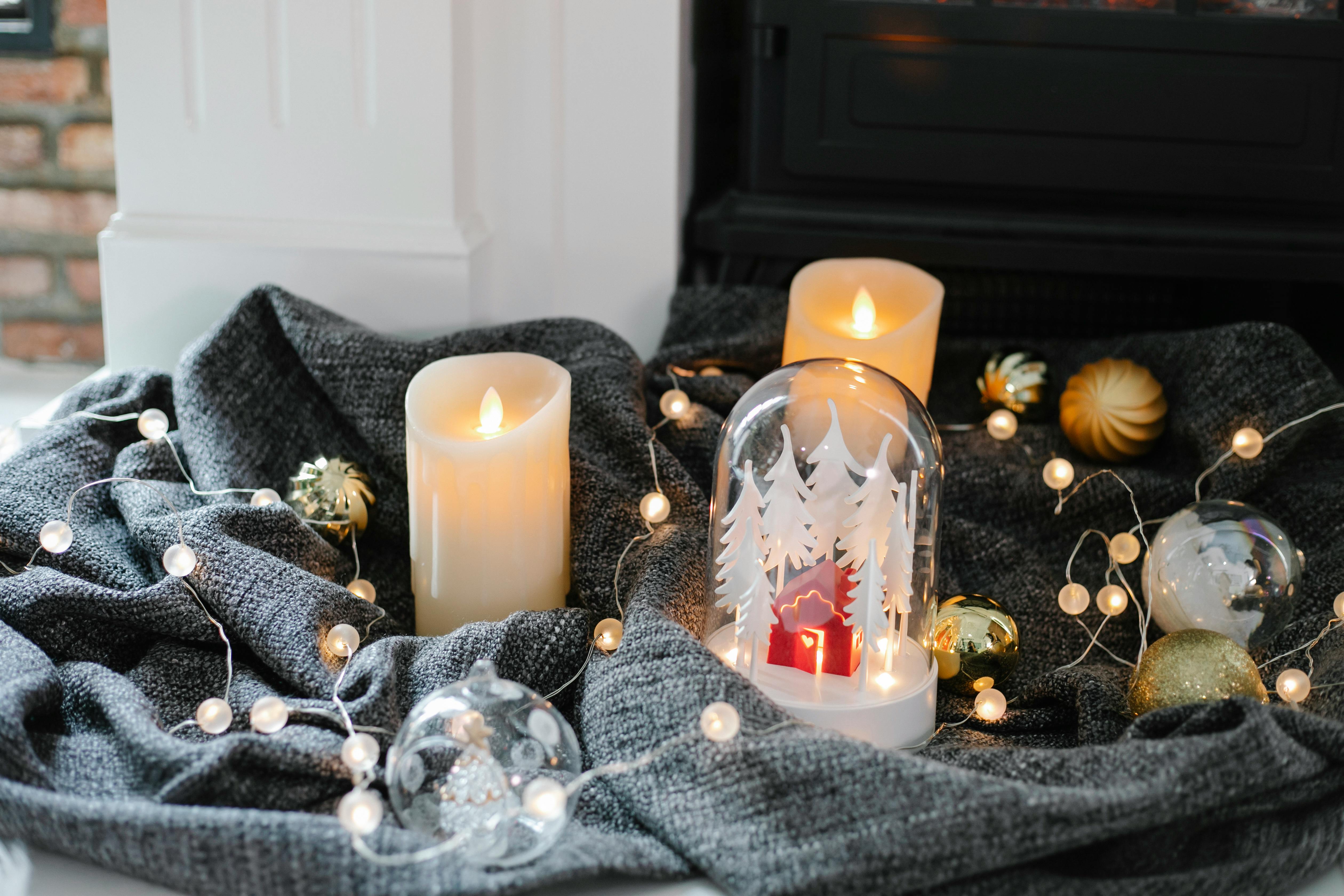 Warm and inviting holiday scene featuring candles, lights, and festive decorations.