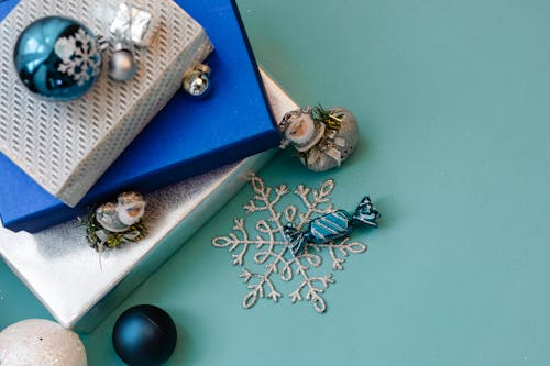 Festive decorations and presents on blue background