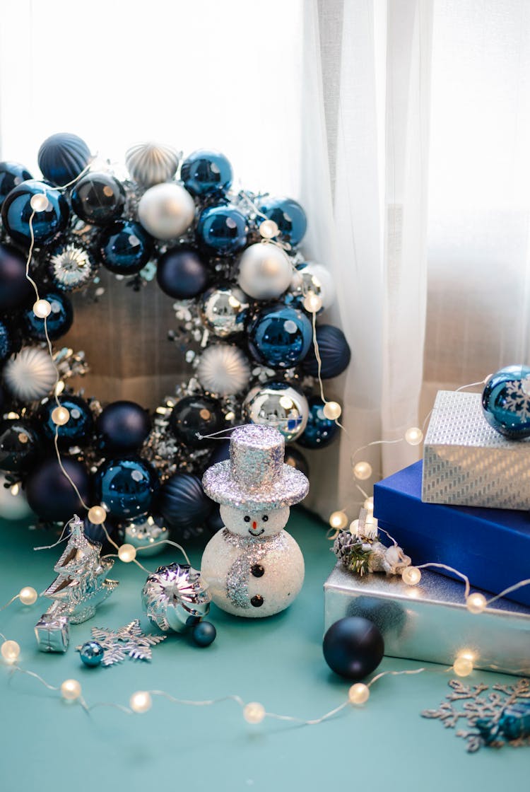 Christmas Decorations And Toys With Presents On Table