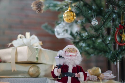 A festive scene with a Santa figurine and Christmas decorations under a tree.