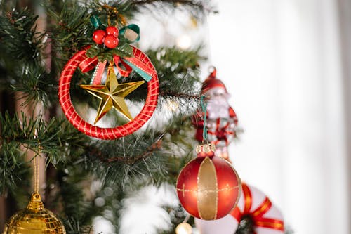 Colorful decorations hanging on Christmas tree