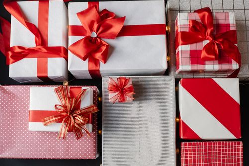 Free Top view of wrapped gift boxes with red bows prepared for Christmas celebration Stock Photo