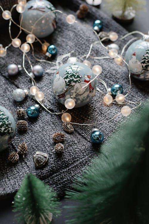 Shiny baubles with garland and fir cones