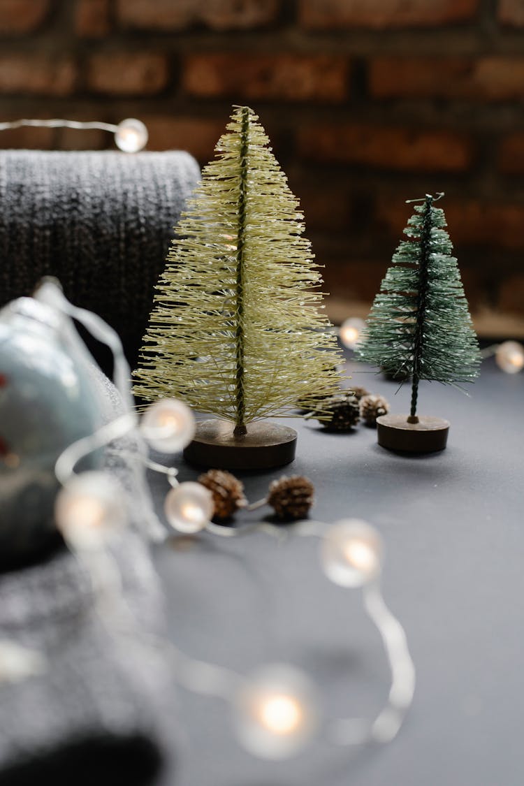 Christmas Decorative Objects Near Fabric On Table In Light Place