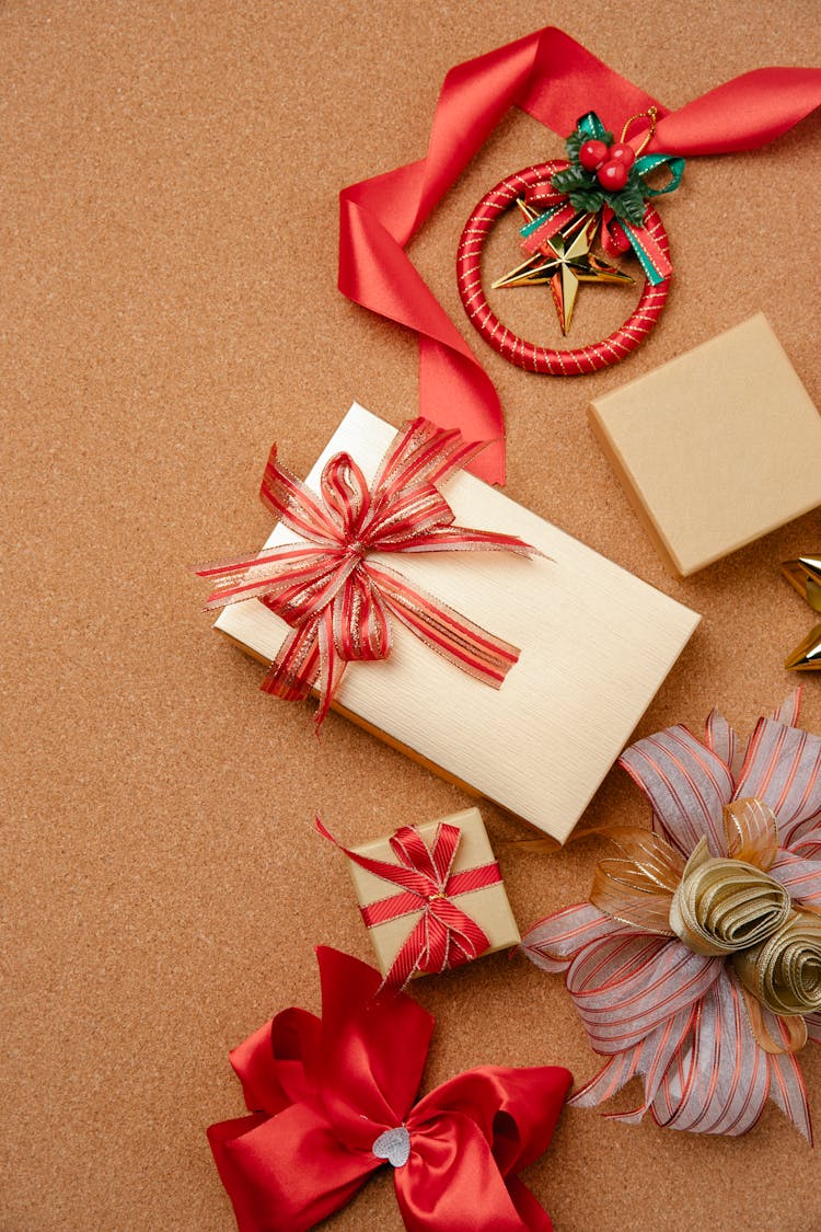 Gift Boxes With Ribbon Bows On Brown Table