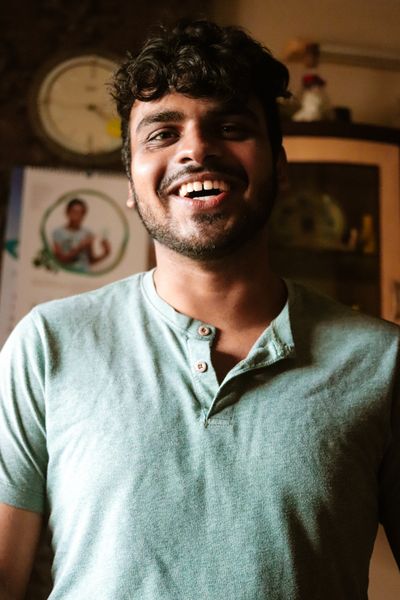 Portrait of a joyful young man with a beard